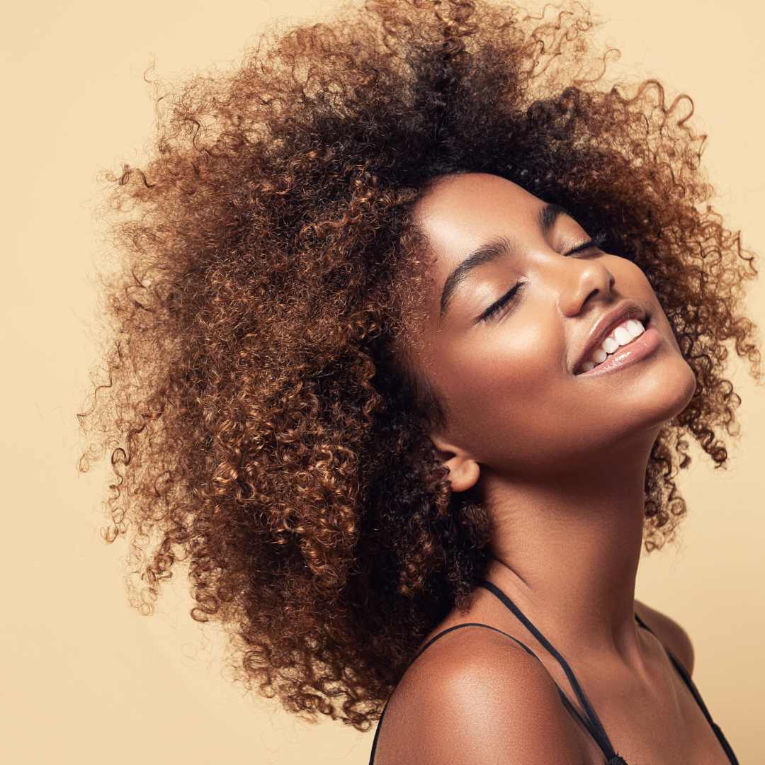 woman, happy, frizzy curly brunette hair