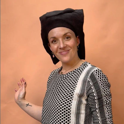 lady using the cold shoulder guard to nestle her curly hair