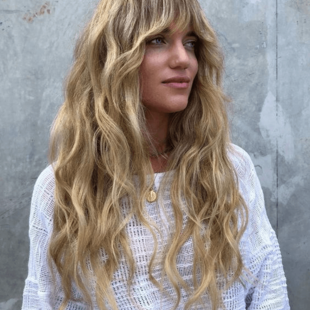 woman with long curly blonde hair