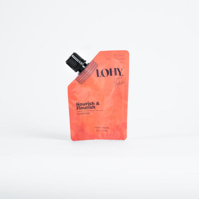 Orange refillable pouch of curly hair conditioner