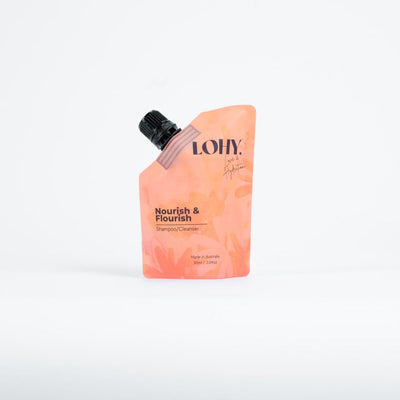 Orange refillable pouch of curly hair shampoo