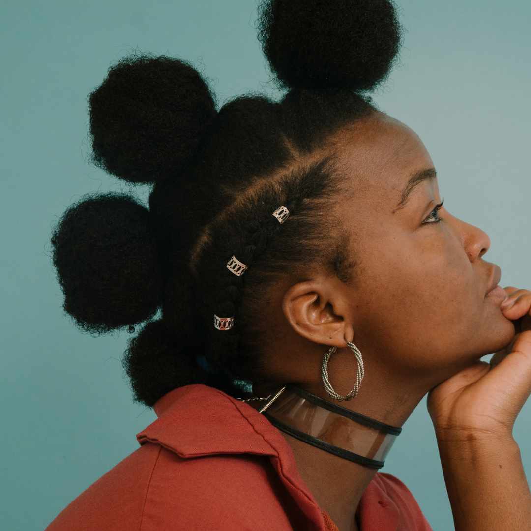 woman, frizzy black hair, bantu knot hairstyle