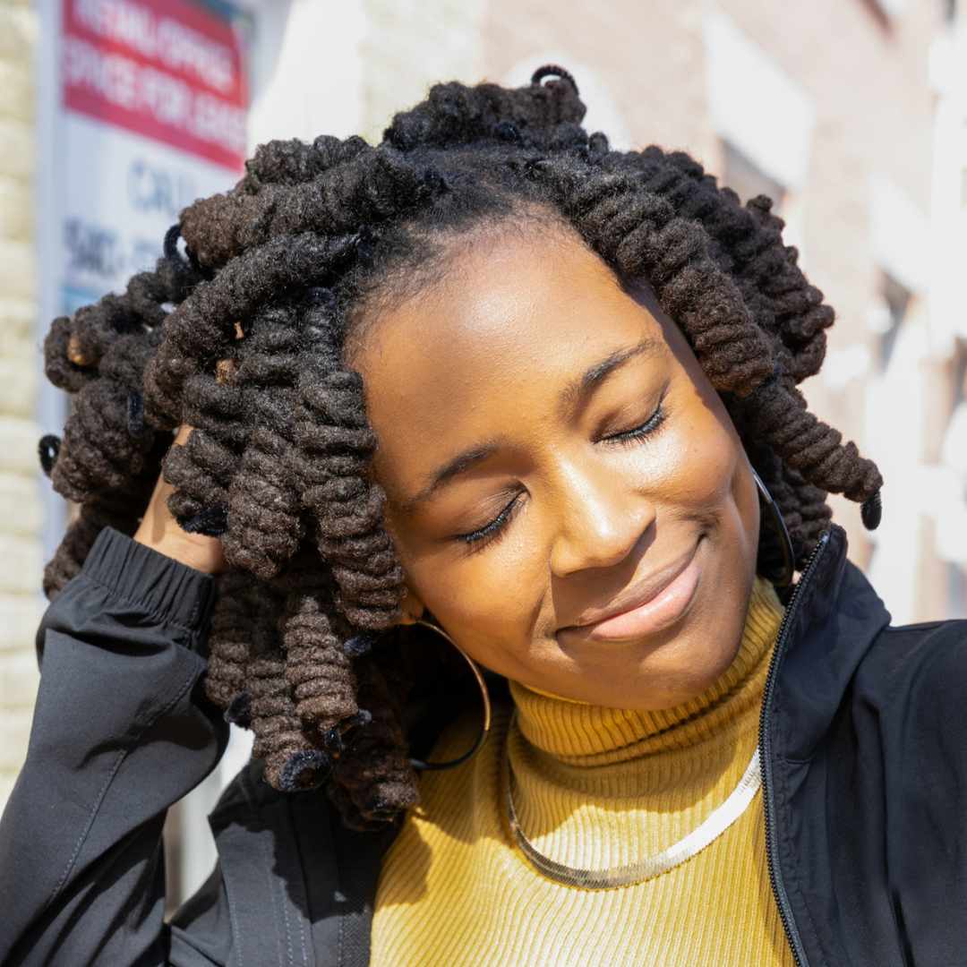 woman, faux locs hair style, curly black hair