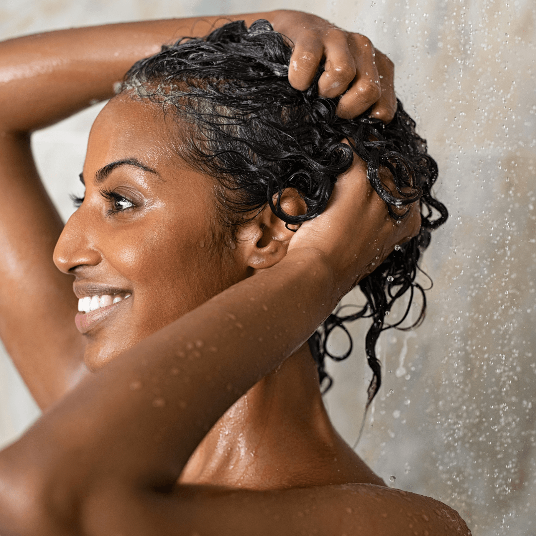 woman, showering, short curly black hair