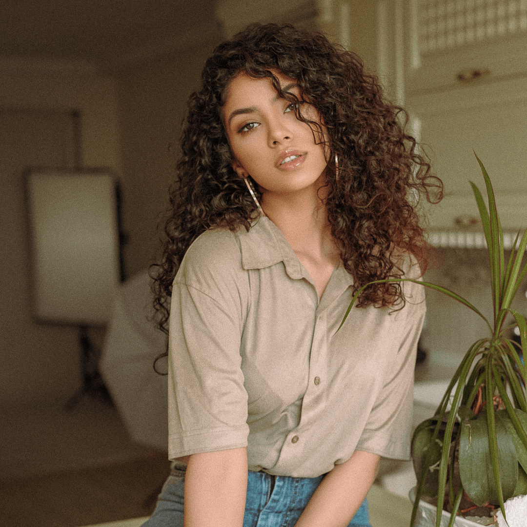 woman with long, curly, brunette hair