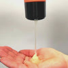 Curly hair shampoo being poured into hand