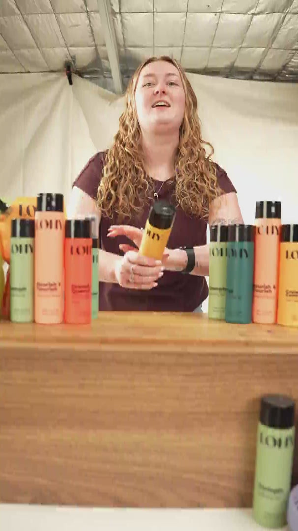 Load video: bella with curly blonde hair talking about how to win the curly-hair product giveaway, by following the steps on the competition page
