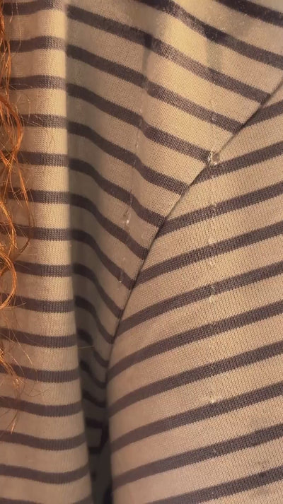 droplets falling down shirt then showing microfibre curly hair shoulder towel protecting clothes from water